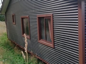 Parcela en venta en Coyhaique con casa mas quincho.