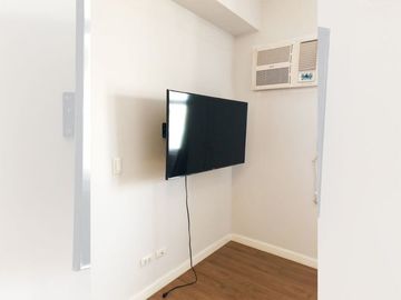 Semi-furnished studio for sale at Two Serendra