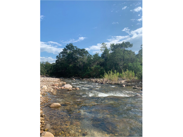 TERRENO CON SALIDA AL RIO CUMBAZA Y CARRETERA