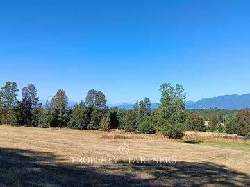 Terreno con linda vista a campos y volcanes