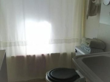 Vendo casa con 3 cabañas y terreno, giro comercial en Iloca.