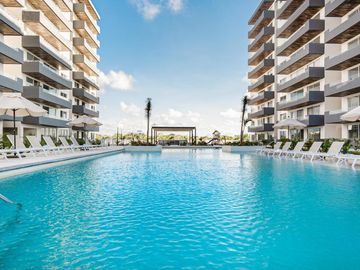 Departamento en Cancún con rooftop y alberca olímpica