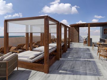 DEPARTAMENTO DE 3 HABITACIONES FRENTE AL MAR Y CLUB DE PLAYA EN COSTA MUJERES