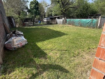 TERRENO CON CASA A TERMINAR