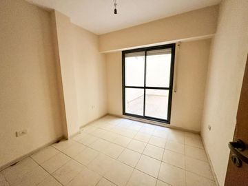 Venta Departamento dos dormitorios con patio. Pichincha - Rosario.