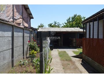 PROPIEDAD CON 2 CASAS AV PRINCIPAL RIO BUENO