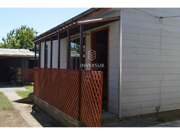 PROPIEDAD CON 2 CASAS AV PRINCIPAL RIO BUENO