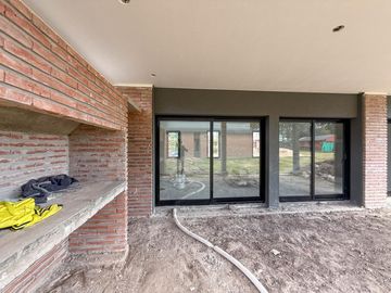 casa premium dos dormitorios patio parrillero condominios tierra de sueños 3 roldan