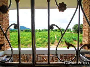 Luxury pool villa on a spacious land plot with mountain views
