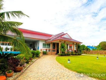 Luxury pool villa on a spacious land plot with mountain views