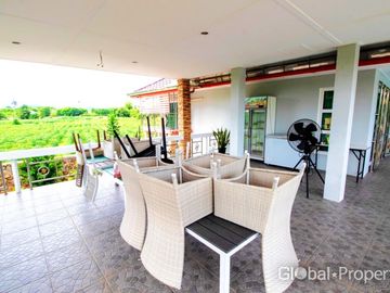 Luxury pool villa on a spacious land plot with mountain views