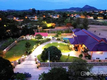 Luxury pool villa on a spacious land plot with mountain views