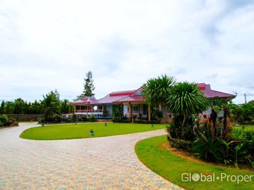 Luxury pool villa on a spacious land plot with mountain views