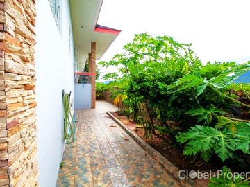 Luxury pool villa on a spacious land plot with mountain views