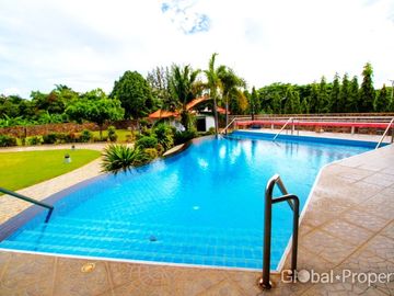 Luxury pool villa on a spacious land plot with mountain views