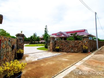 Luxury pool villa on a spacious land plot with mountain views