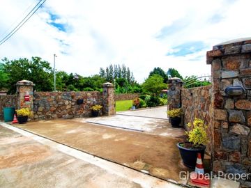 Luxury pool villa on a spacious land plot with mountain views