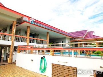 Luxury pool villa on a spacious land plot with mountain views