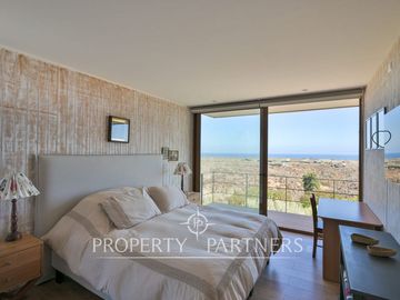 Casa de Ensueño con Vista Despejada al Mar en Exclusivo Condominio Agua Dulce, Huentelauquén