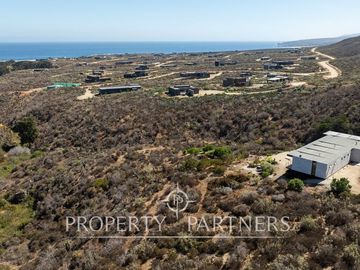 “Vive Frente al Mar en Agua Dulce: Terreno Exclusivo con Vista Inalterable en Huentelauquén”