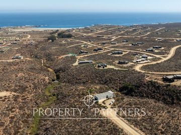 “Vive Frente al Mar en Agua Dulce: Terreno Exclusivo con Vista Inalterable en Huentelauquén”