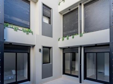 VENTA- Departamento - A estrenar - 2 dormitorios con Patio y Cochera- Centro, Rosario.