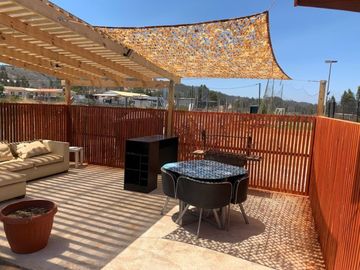 FOCOLARE PROPIEDADES VENDE PARCELA CON CASA EN ALGARROBO