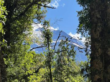 Terreno con vista al volcán y bosque en Reserva biológica Huilo Huilo