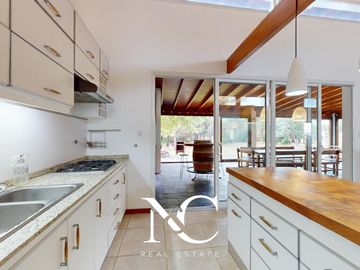 Casa en venta en Costa Esmeralda con fondo libre arbolado