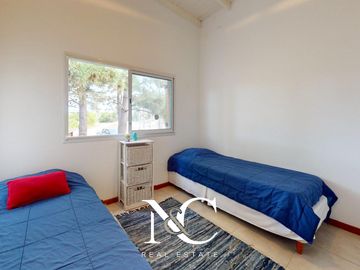 Casa en venta en Costa Esmeralda con fondo libre arbolado