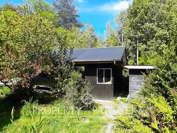 Casa bosque en terreno de media ha en Panguilelfún