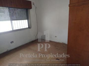 CASA DE 4 AMBIENTES CON FONDO Y GARAGE ITUZAINGO NORTE
