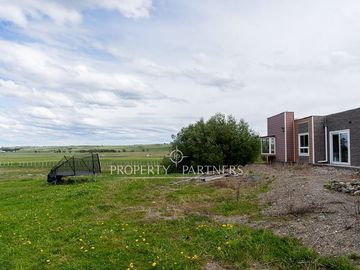 Gran terreno con casa en sector Leñadura