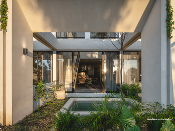 Departamento con recámara en planta baja y jardín