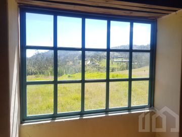 CASA Y TERRENO DE VENTA ZHIDMAD AZUAY