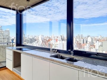 VENTA DEPARTAMENTO DE CATEGORIA, DOS DORMITORIOS CON BALCON VISTA AL RIO Y AMENITIES EN ZONA CENTRO