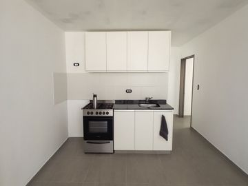 Venta de Departamento de 2 Dorm. en planta baja, con cochera y patio