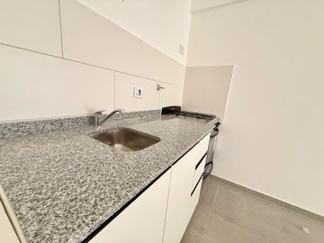 Venta de Departamento de 2 Dorm. en planta baja, con cochera y patio