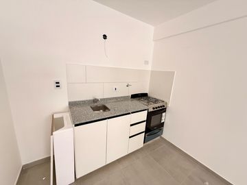 Venta de Departamento de 2 Dorm. en planta baja, con cochera y patio