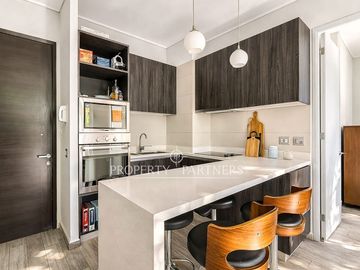 Departamento mariposa en primer piso con patio privado, Av. Las Condes
