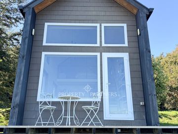 Espectacular casa con tiny house independiente y vistas al mar · Pichiquillaipe, Carretera Austral, Puerto Montt