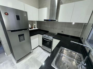 CASA EN VENTA A ESTRENAR 2 DORMITORIOS Y JARDIN