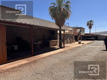 TERRENO EN VENTA EN AV. ZARAGOZA CON BODEGAS