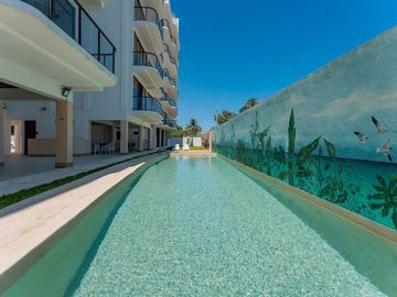 DEPARTAMENTO EN VENTA EN LA PLAYA CERCA DEL MAR EN CHICXULUB, AMUEBLADO