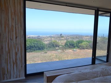 Parcela con casa vista al mar en Los Molles
