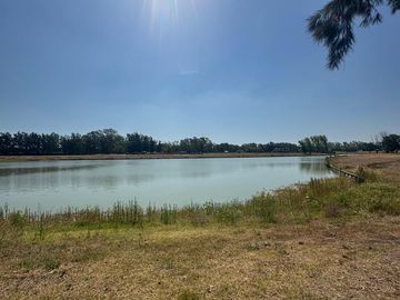 Terreno Sobre La Laguna en Azzurra, Tortugas, Pilar