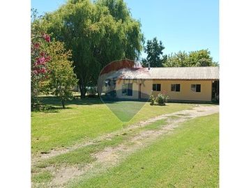 Parcela con dos casas en Champa: ¡Un Sueño!