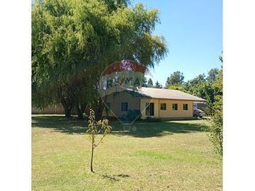Parcela con dos casas en Champa: ¡Un Sueño!