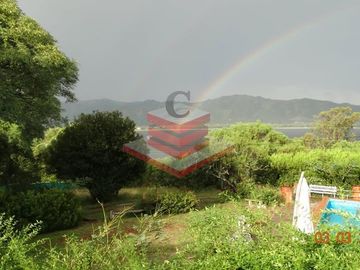 CASA EN VENTA EN SIQUIMAN CON AMPLIO TERRENO DE 3.883,47 m²  VISTA A LAS SIERRAS Y PILETA REF:3026
