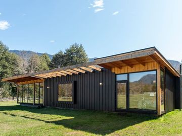 Parcela con casa vista al volcán